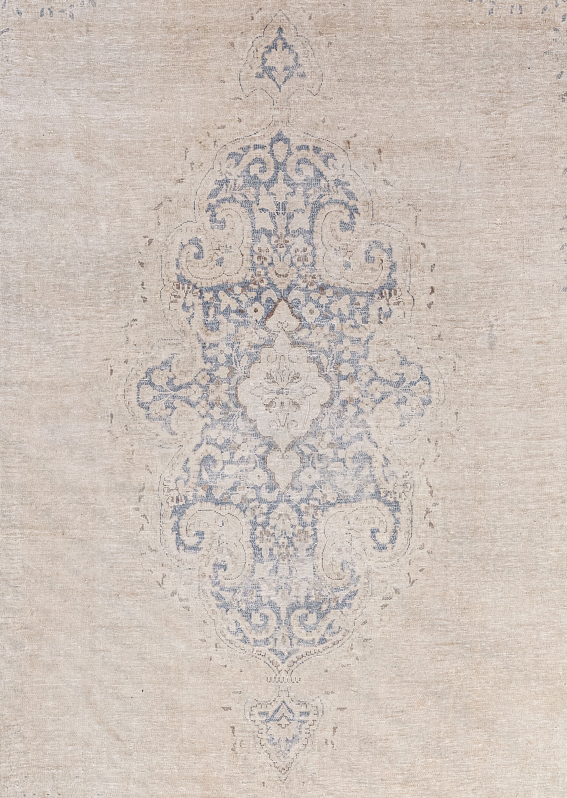 The close-up of the carpet features an embellishment that has a nested mandala. 