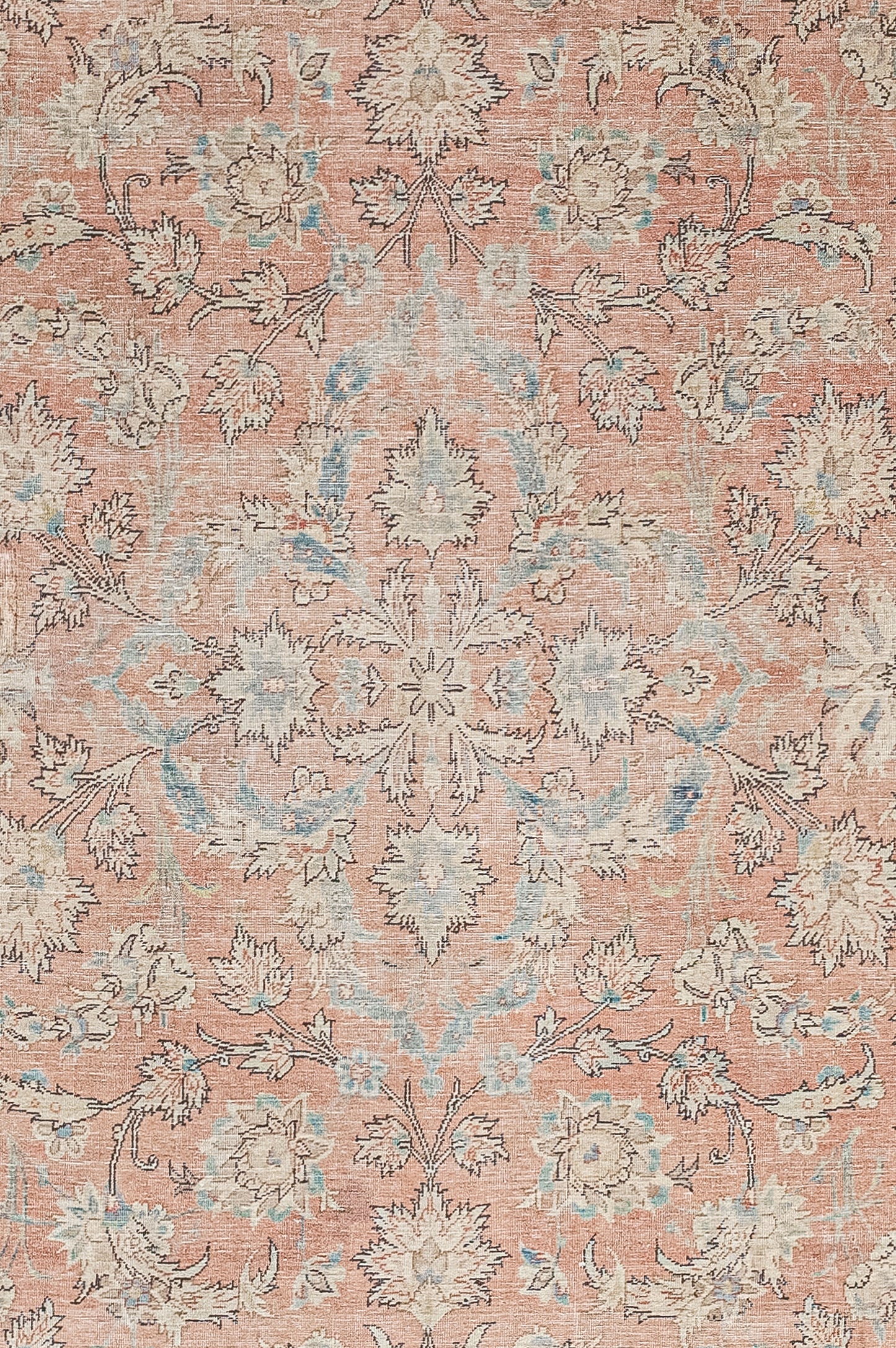 The foreground of the rug features a striking floral composition made up of symmetrically arranged perennial carnations.