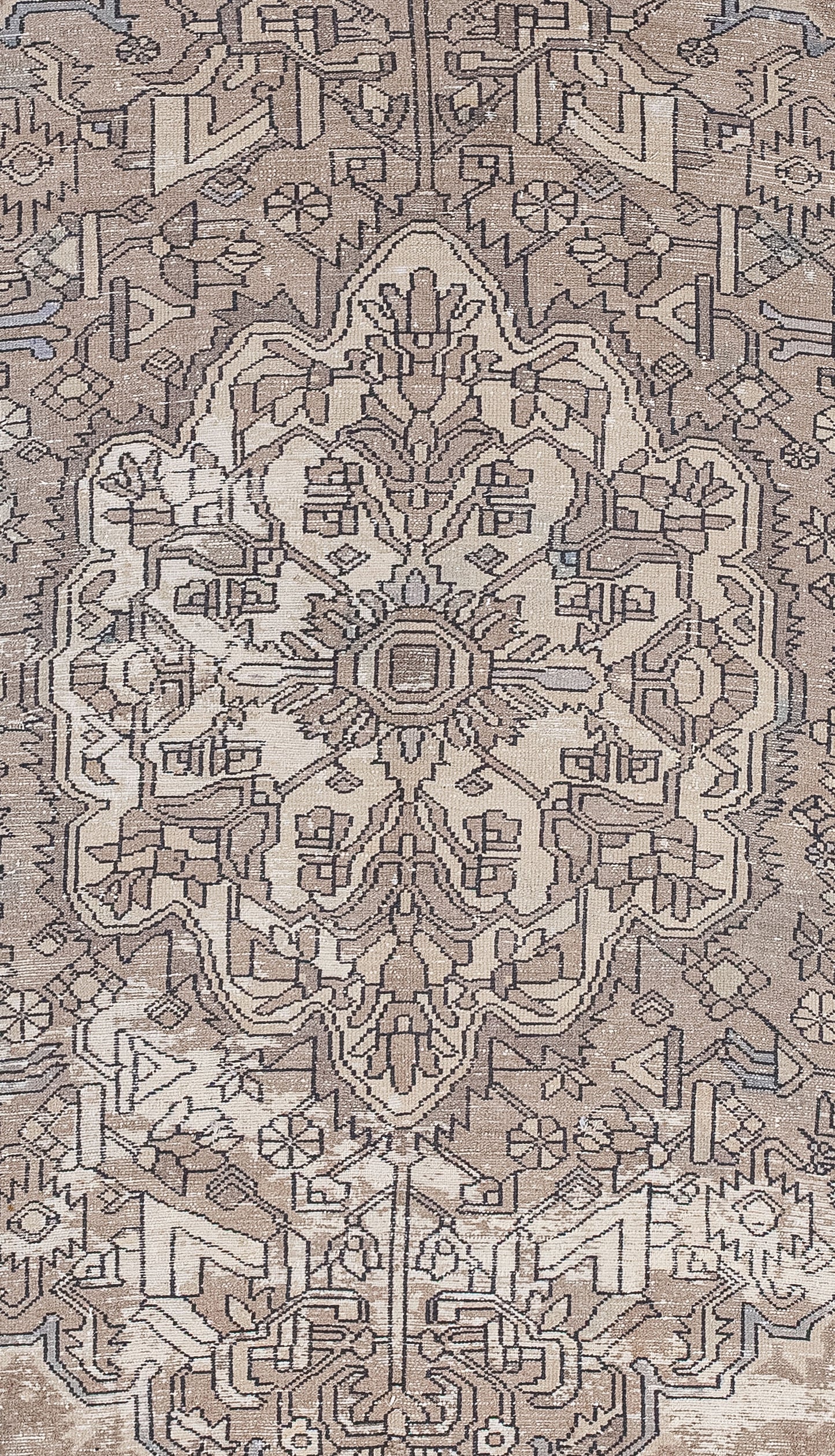 The rug's close-up features a tribal mandala filled with abstract figures, all connected to each other, and a small central square.
