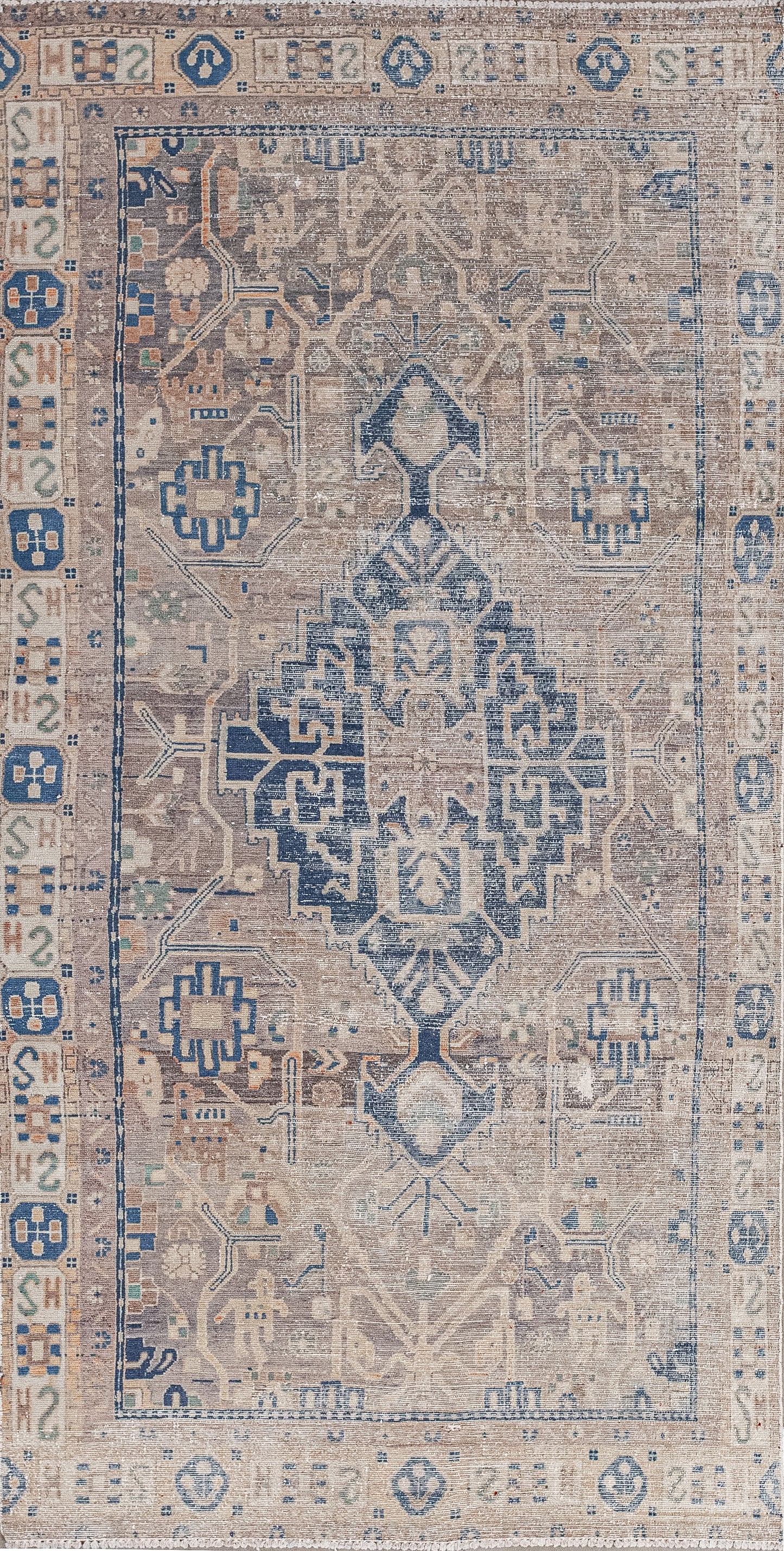 This quirky rug comes with a ton of symbols that are open to representation. The woven colors are variations of brown for the background and royal blue for the pattern.