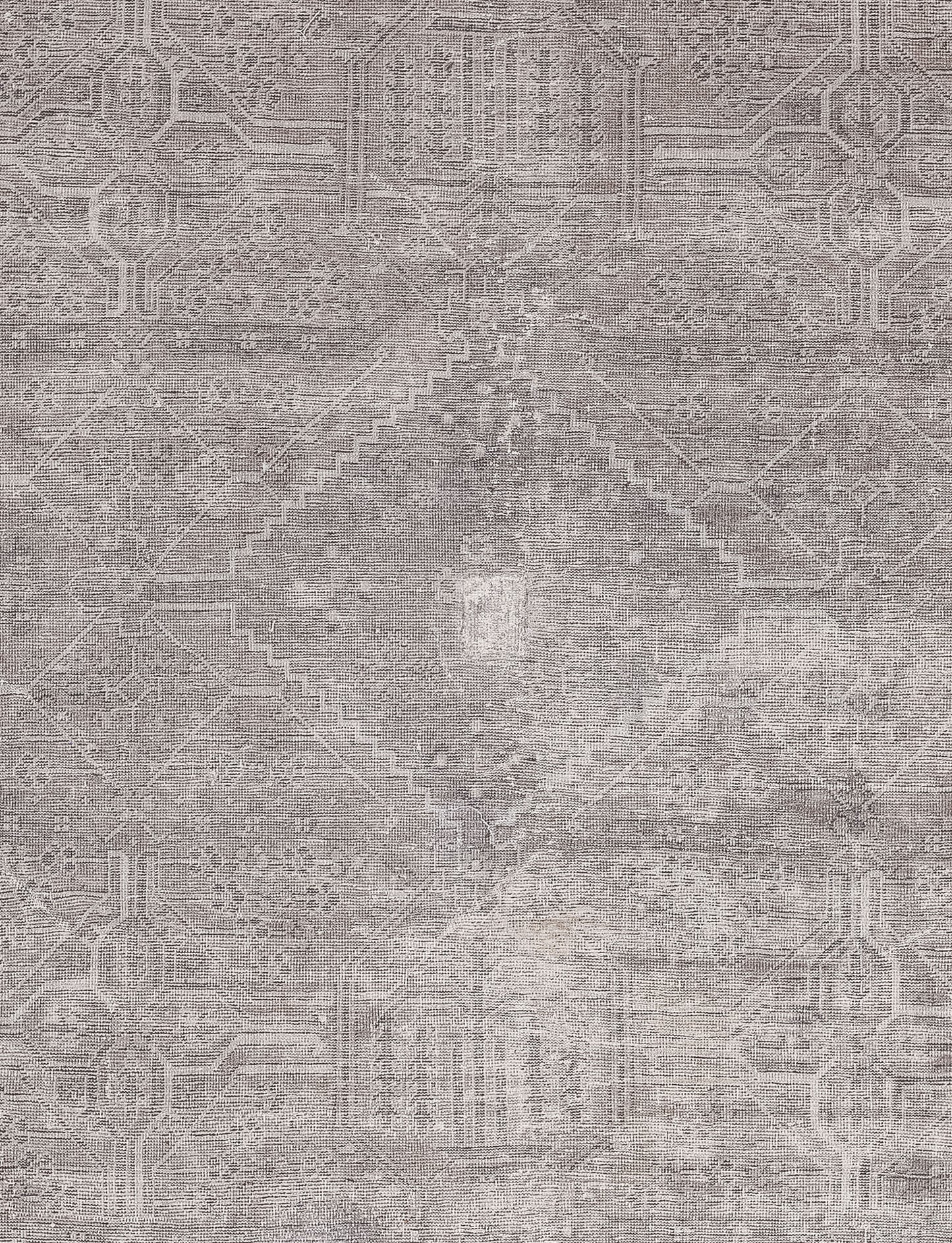 The center of the rug features two fused pyramids creating a diamond shape with abstract polygons merged on each edge. 
