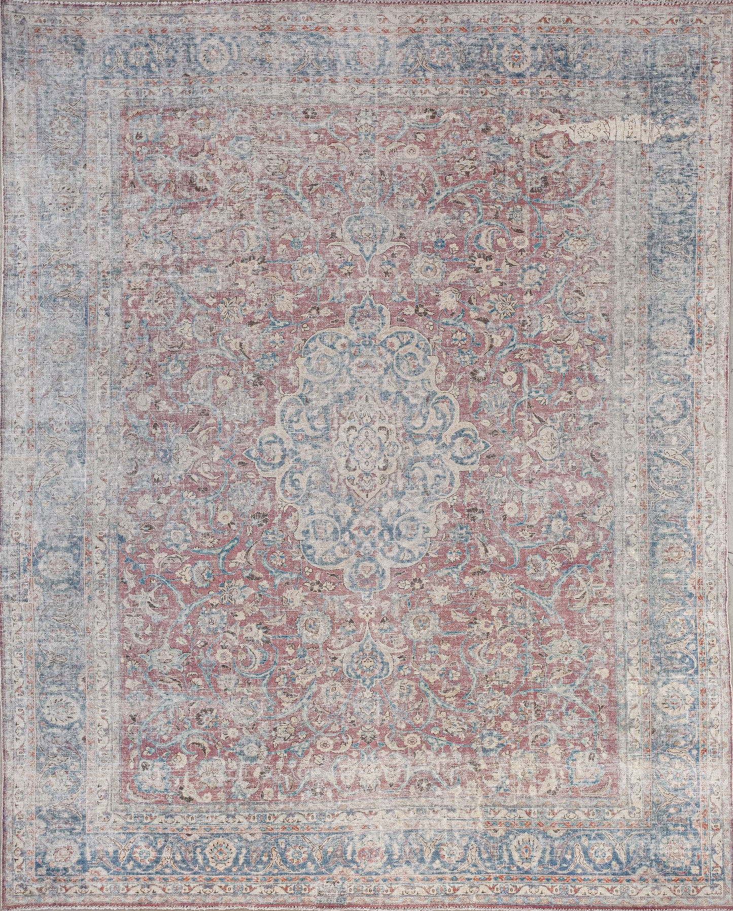 This ambitious rug was woven with psychological seriousness and powerful energy. The color palette has burgundy as the dominant tone, blue and beige for the frame and pattern, and some orange accents