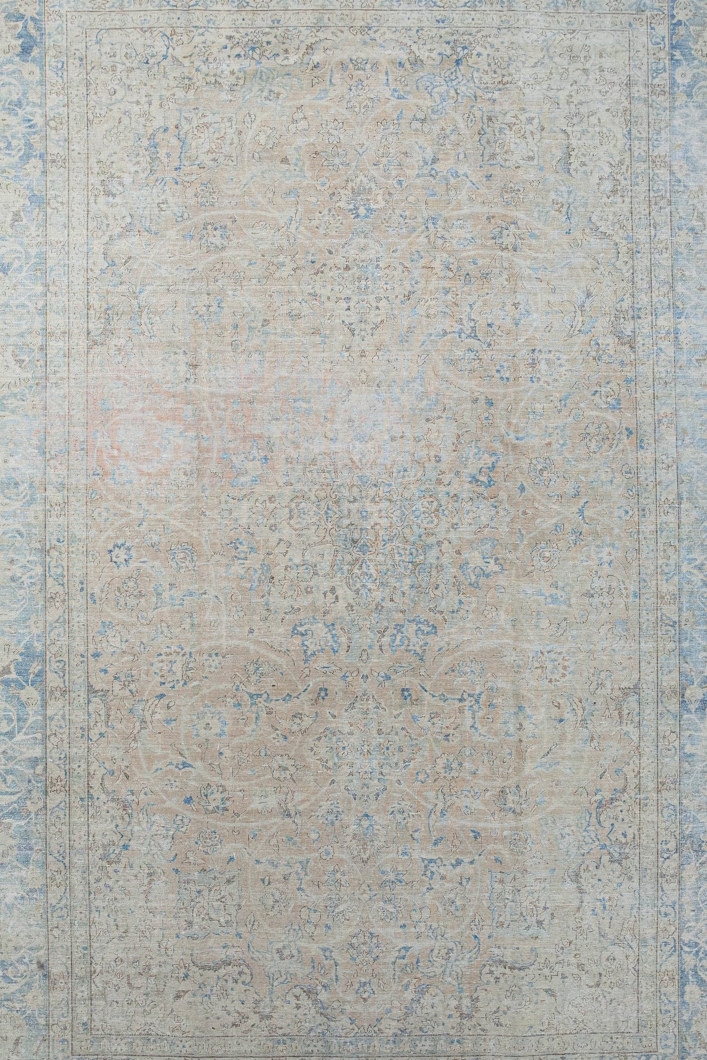 A big distressed snowflake is the centered design of this rug.