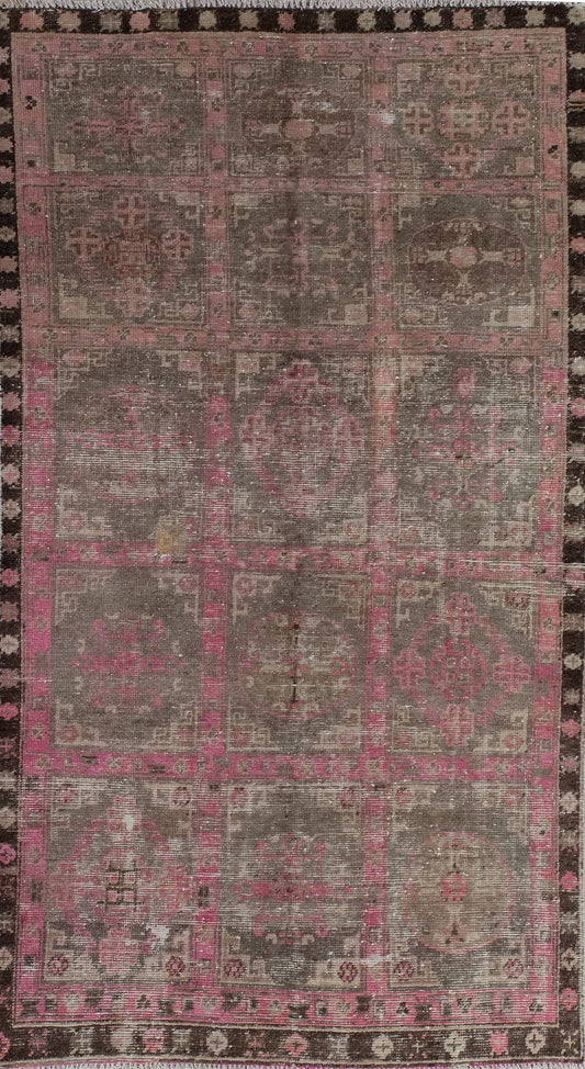 Ancient rug comes in distressed finish. The color scheme has black, gray, and pink. The pattern is a pink grid that creates fifteen squares, which contain fade-in pink crosses inside of each square.