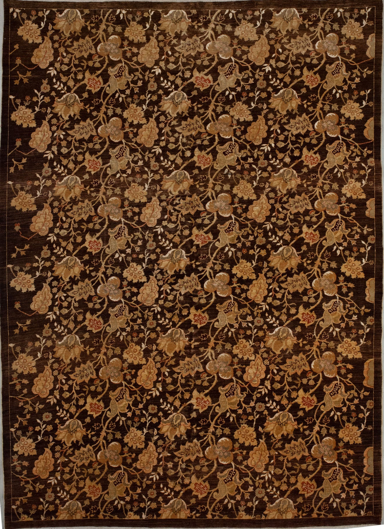 This classy rug comes with a climbing leaves and flowers pattern, and the color scheme has different tones of brown, black, and details in burgundy. 