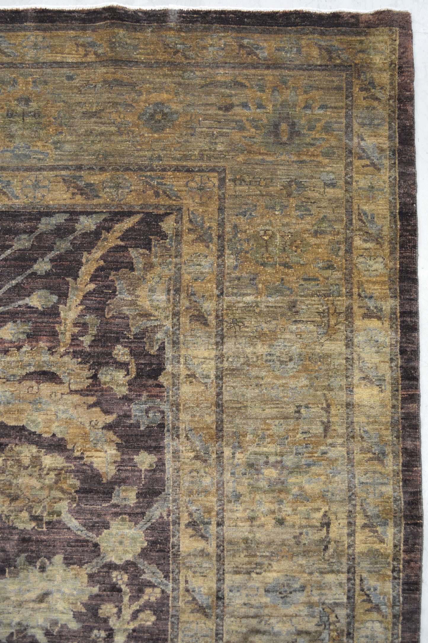 This impressive carpet has the multi frames in yellow with leaves and flowers' pattern.