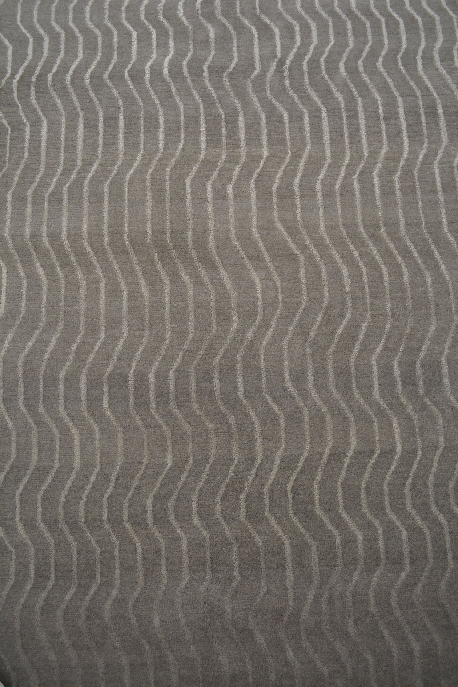 The center's close-up shows that every wave line has the same separation from each other. 