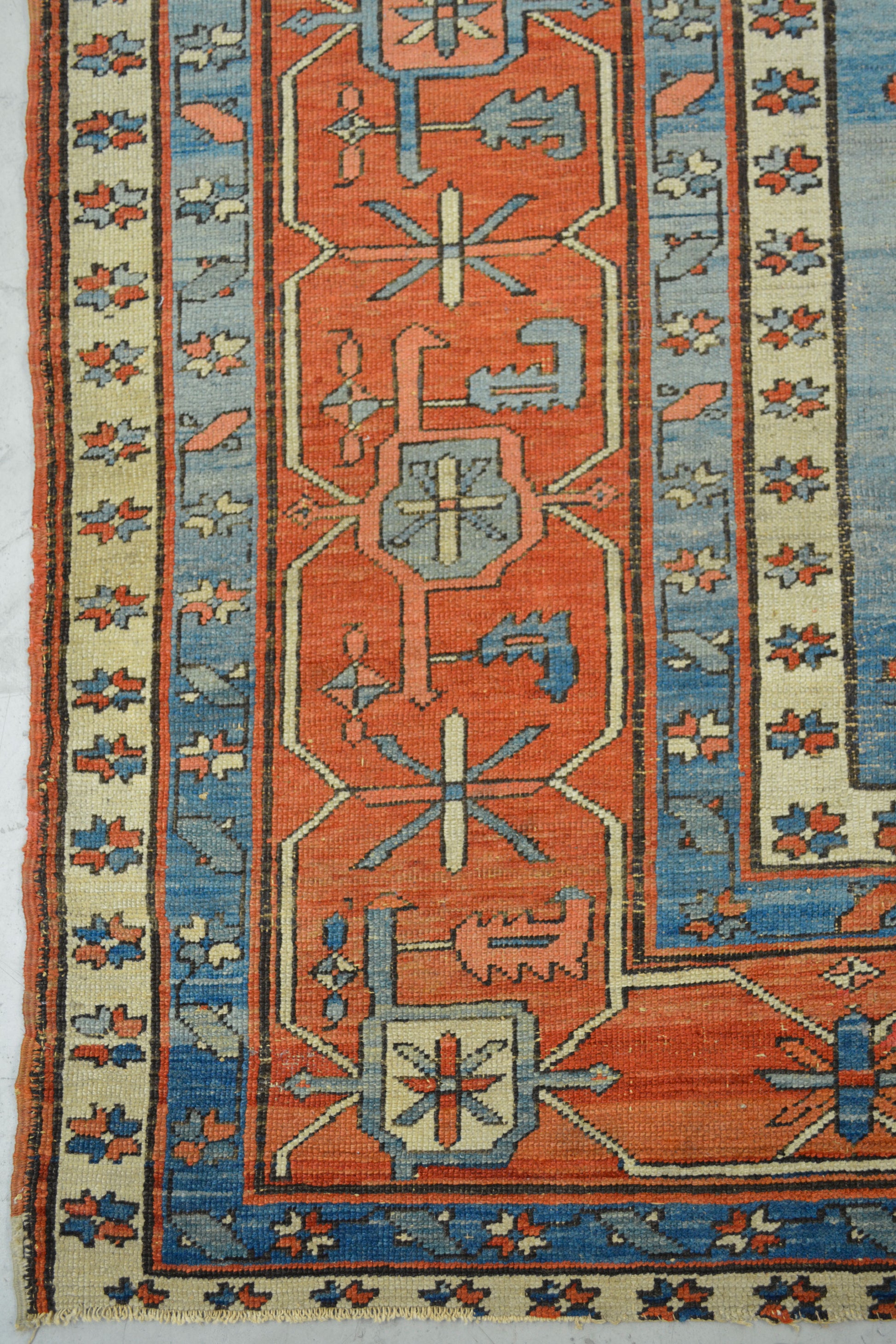 This rug comes in an antique style with a pleasant color scheme in different tones of blue, orange, white, and green.