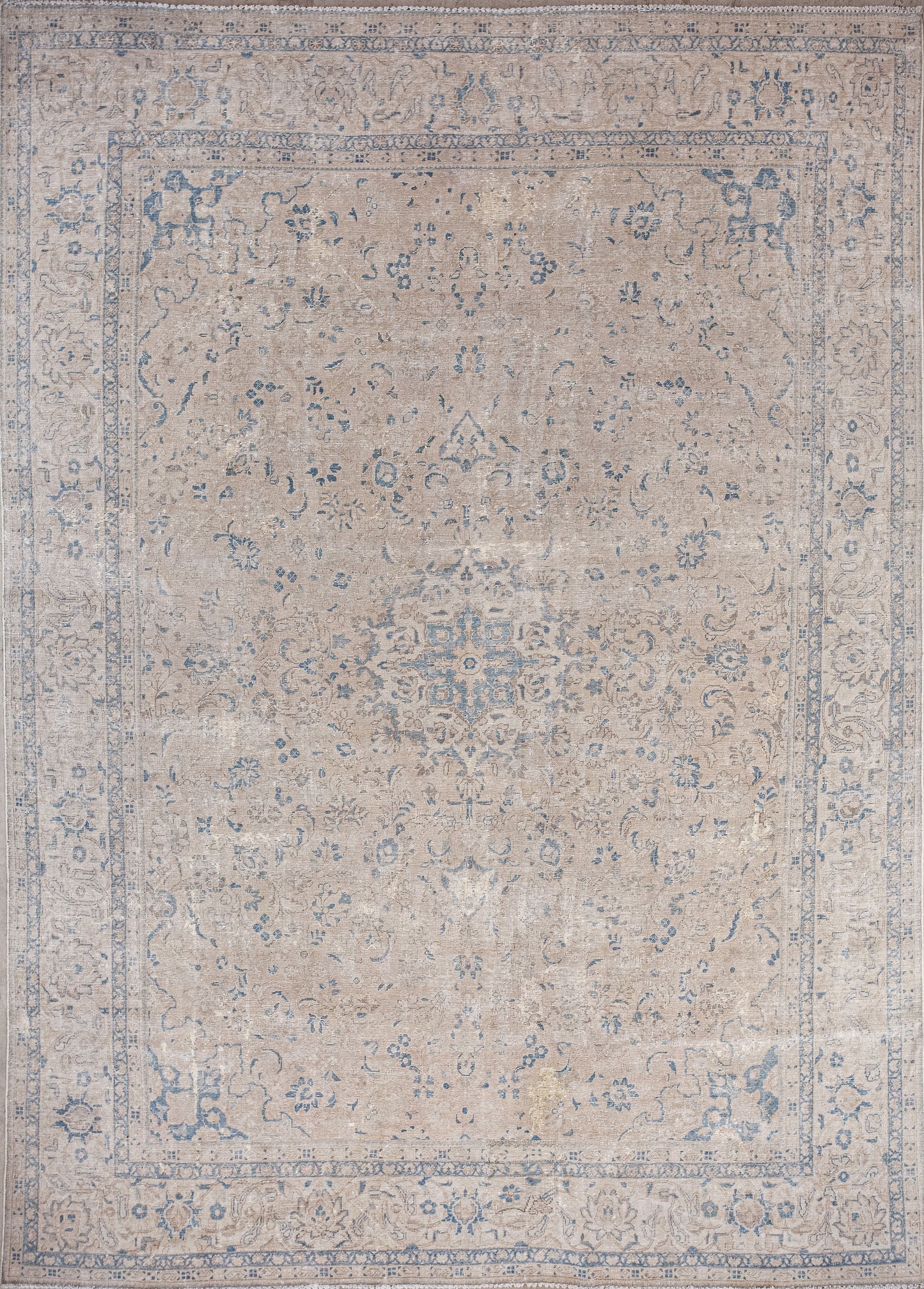 A superior rug was woven with an elegant champagne tone background. The light blue trim pattern adds flair to this quality rug.