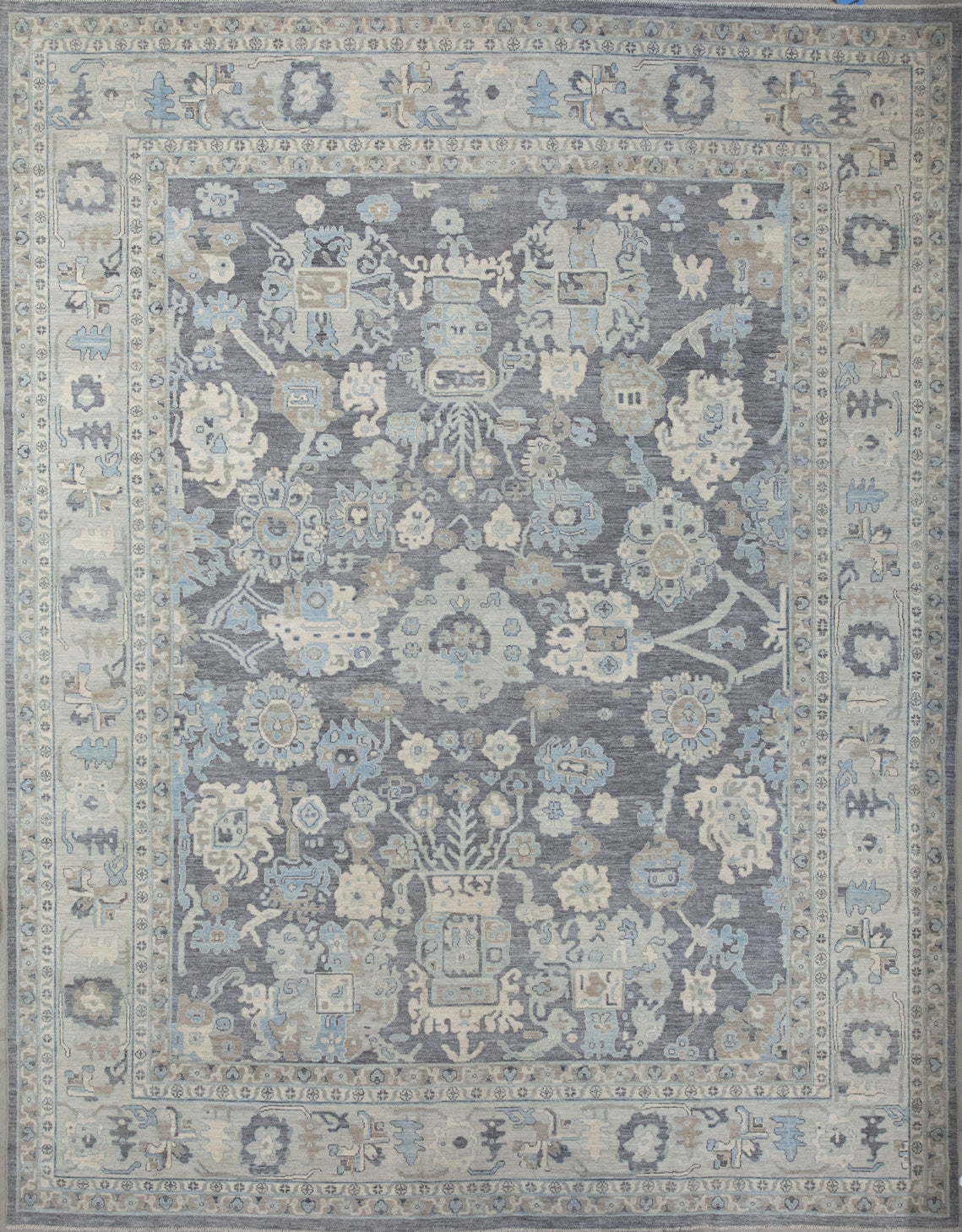 Finest rug comes with an elegant color scheme which has brown, beige, and light blue. The design renders abstract flowers, branches, and corals.
