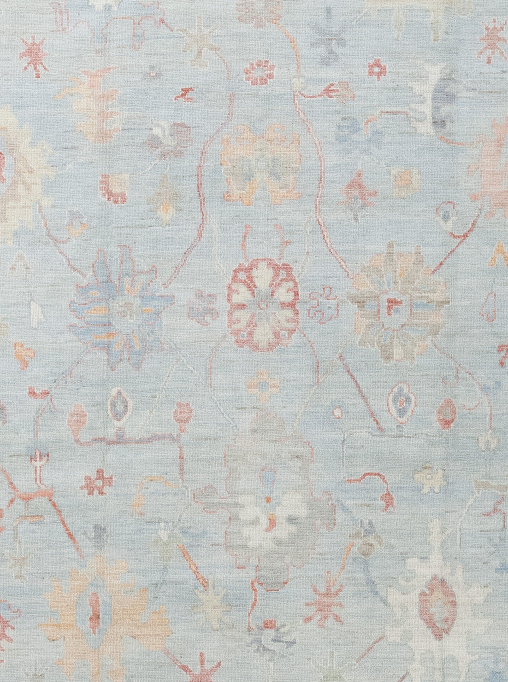 The center of the rug features large abstract sunflowers on a blue background.