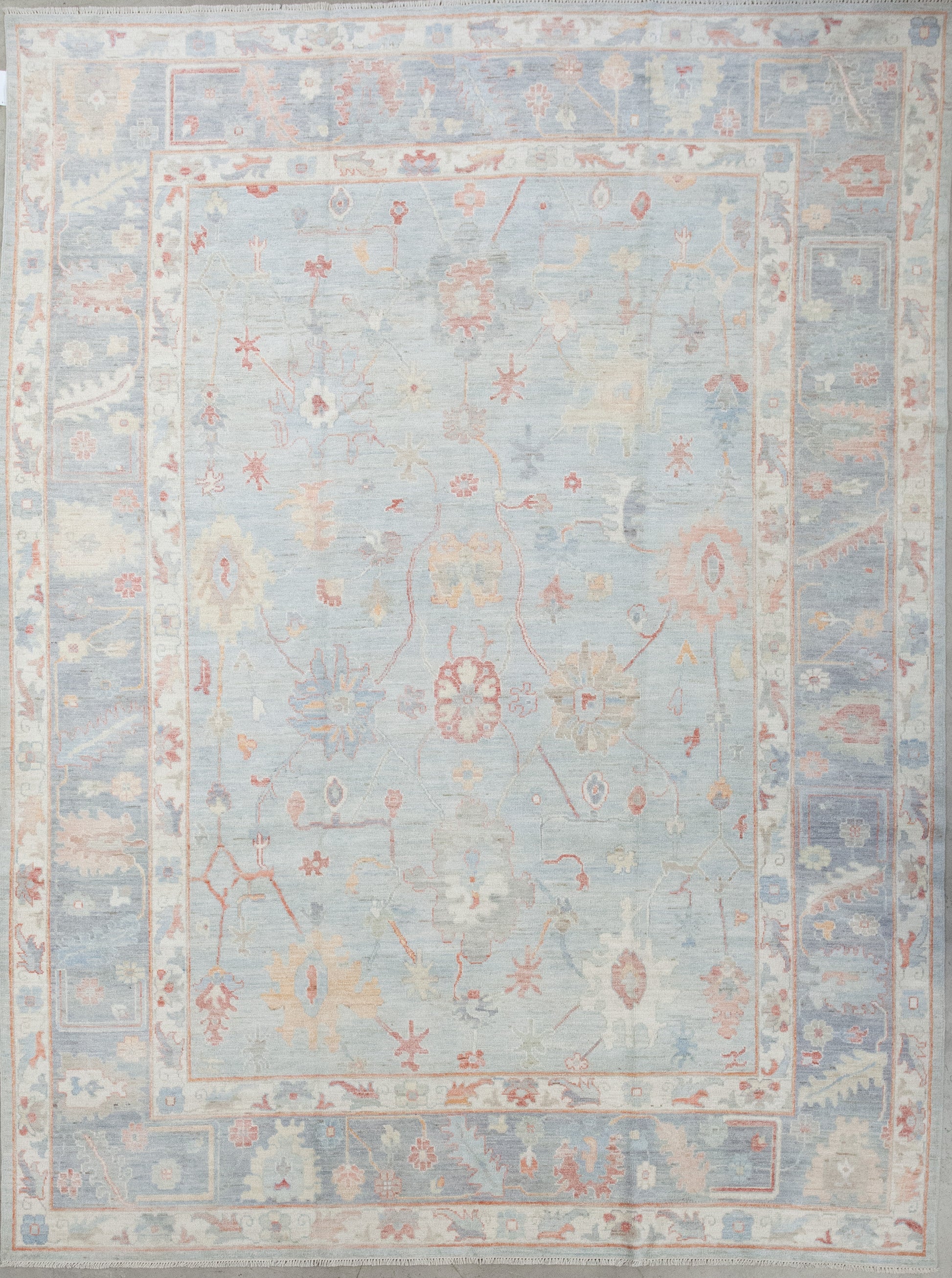The elegant rug was woven in a simple color scheme that has variations of blue as the main hue with red, yellow and green accents. The design features an abstraction of sunflowers, white jasmine, and other types of flowers. 