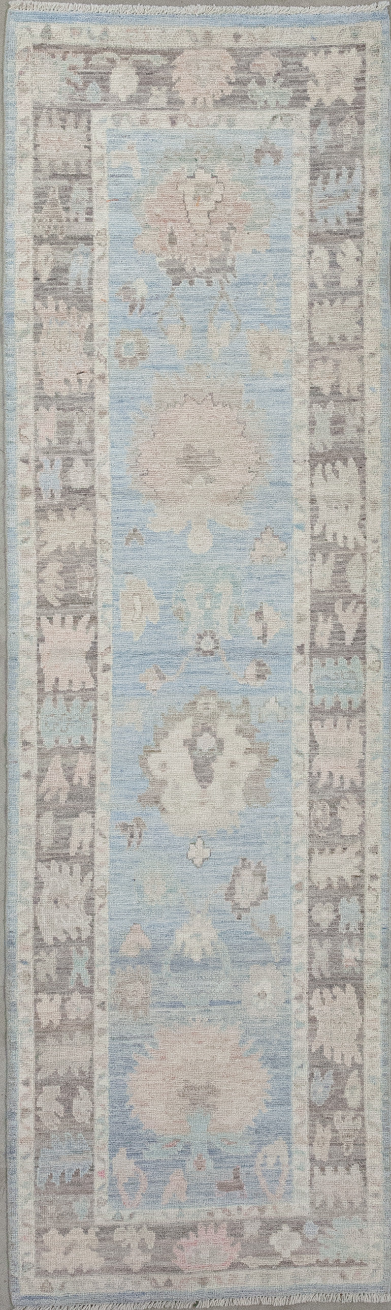 Hallway rug was woven with a cloudy tone for the background and an elegant brown frame. 