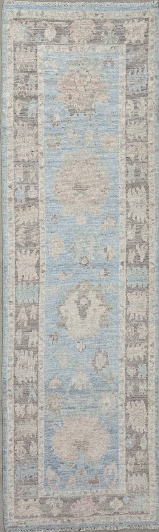 Hallway rug was woven with a cloudy tone for the background and an elegant brown frame. 