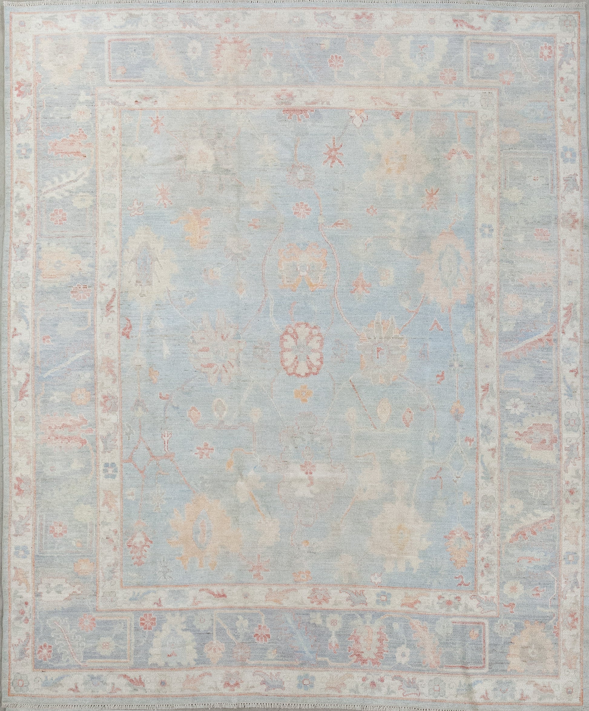 This elegant rug was woven in a simple color scheme that has variations of blue as the main tone plus red, yellow and green accents. The design features an abstraction of sunflowers, white jasmine, and other types of flowers.