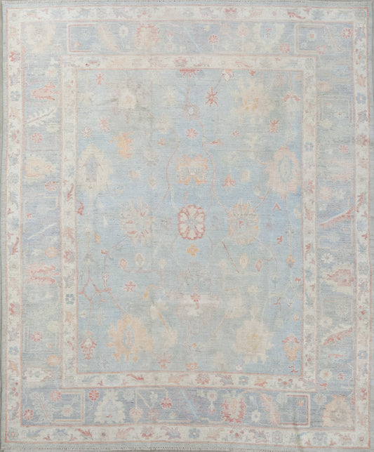 This elegant rug was woven in a simple color scheme that has variations of blue as the main tone plus red, yellow and green accents. The design features an abstraction of sunflowers, white jasmine, and other types of flowers.