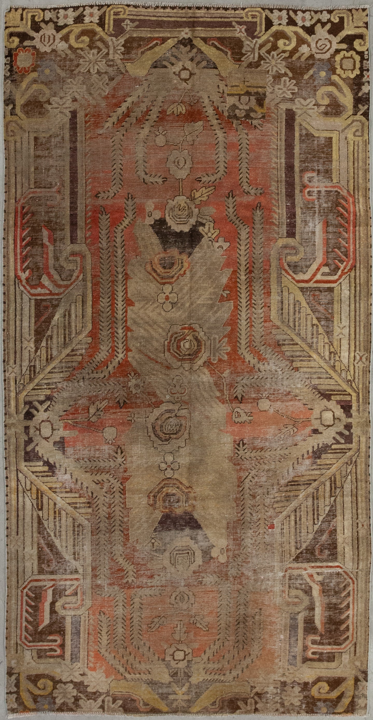This slightly strange carpet was woven with an exciting color scheme that comes with orange for the central background, gold for the contour, and brown and beige for the details.