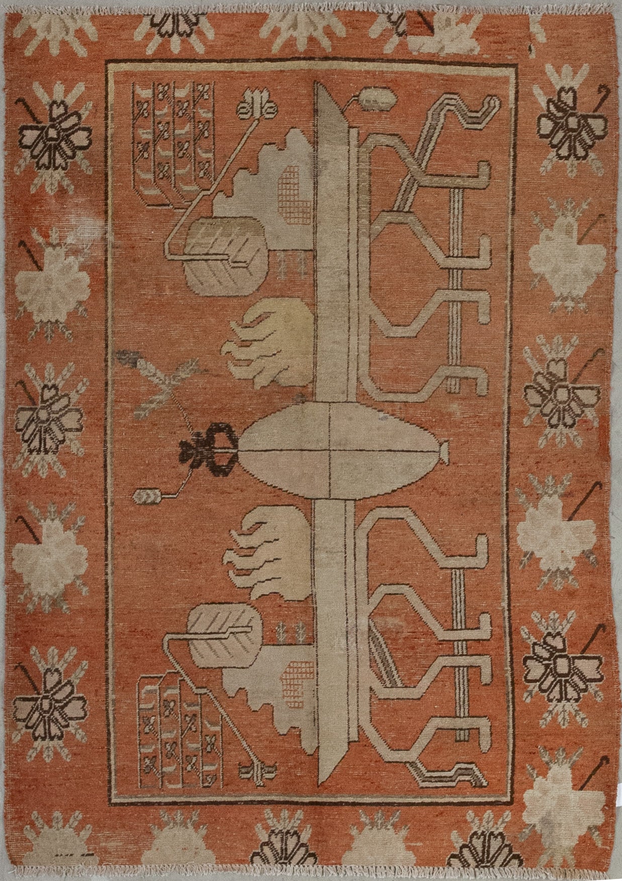 This minimalistic rug comes with an optimistic color scheme which has orange for the entire background, beige for the central artwork, and brown for the outline. The design features an 8-legged table that holds two flame shapes on top.