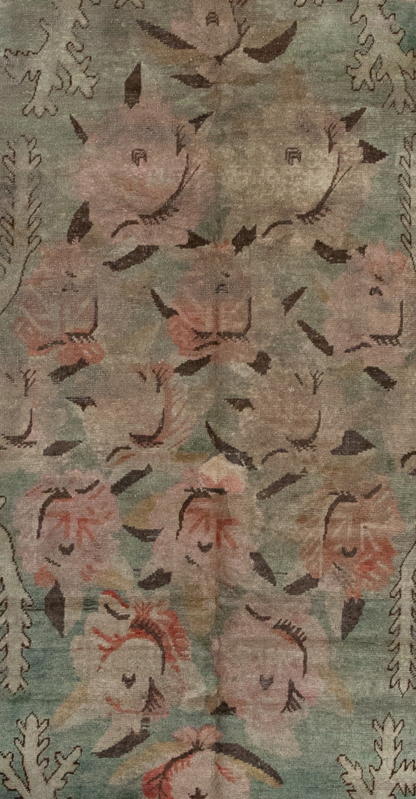 The center of the rug features 16 pink roses with black petals over green background.