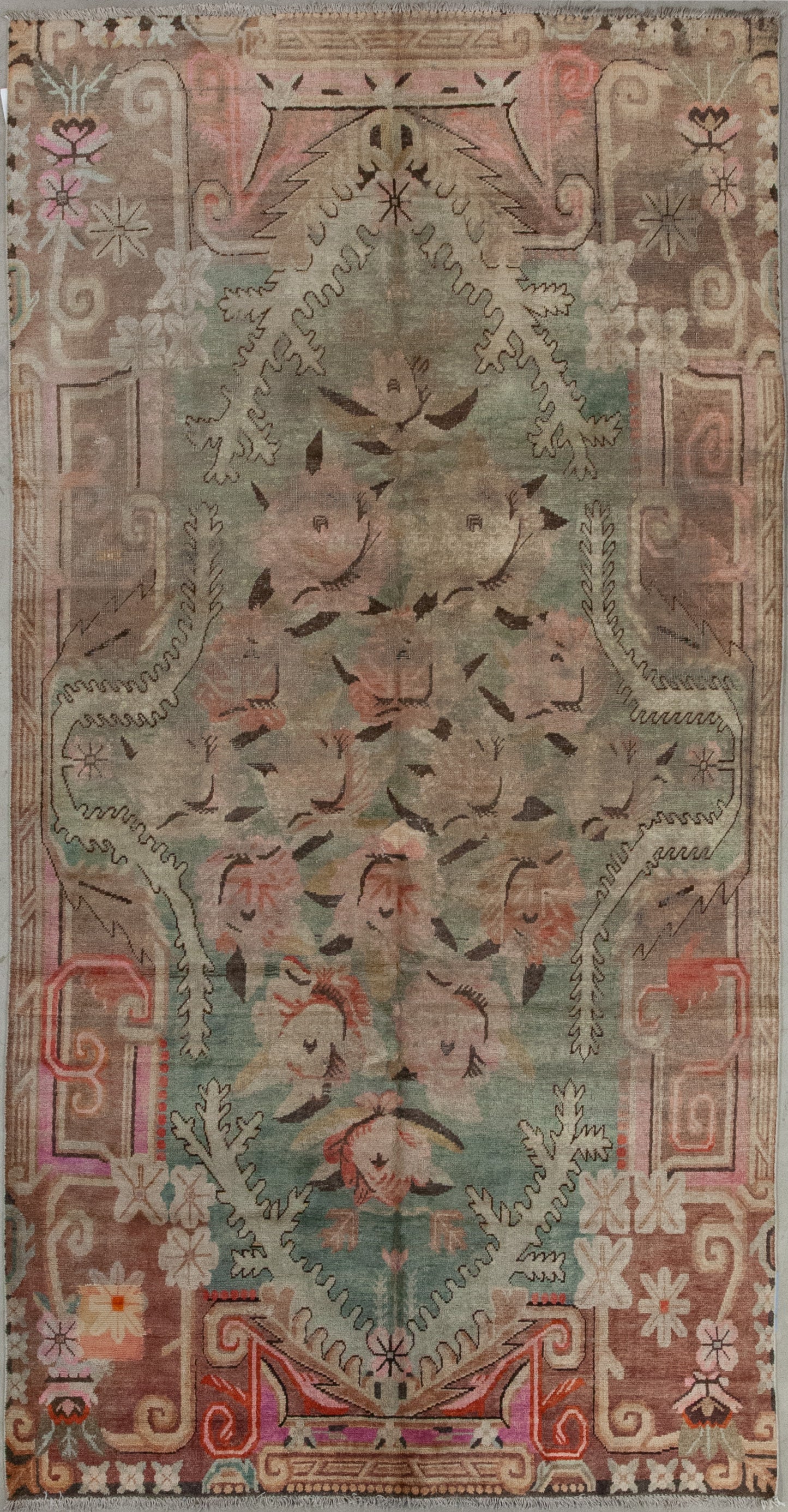 This distinctive carpet was woven to represent a roses garden in an abstract manner. The color scheme comes with dusty greenish for the central background, pink for the main artwork, brown for the contour, and black and white to create contrast.