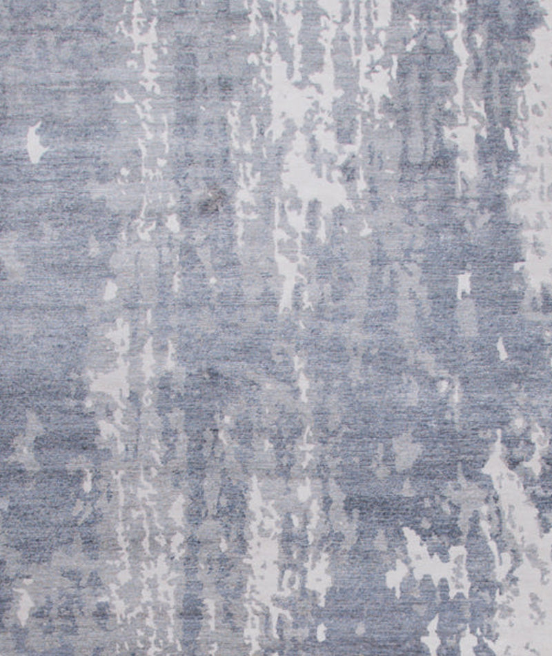 The rug's close up dives right into the light blue and gray stylish design.