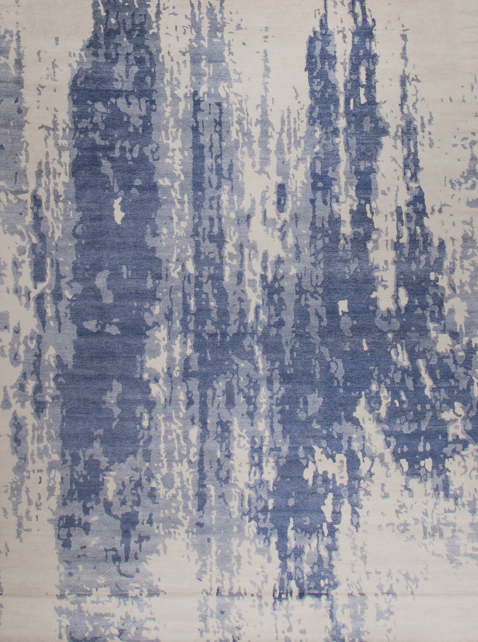 modern white rug with a vertical distressed navy blue design