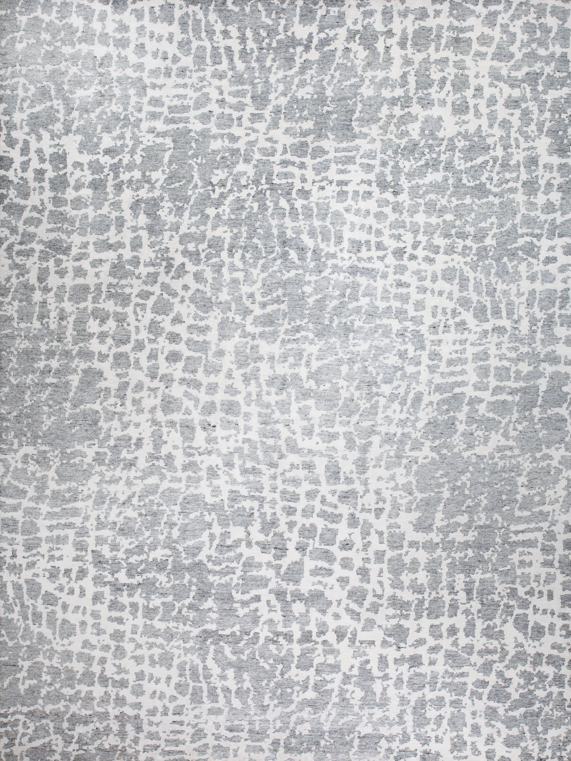 Modern rug comes with a gray spot pattern over white background. 