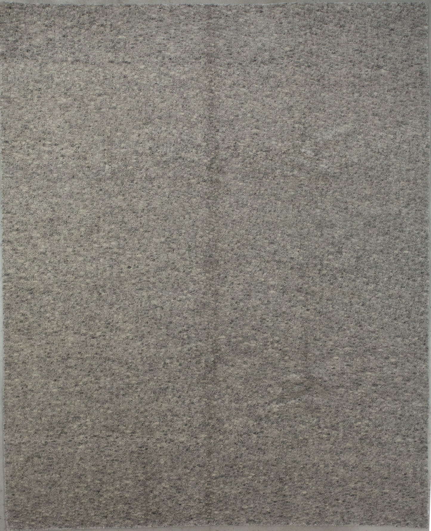 Modern carpet wove with gray and beige color scheme.