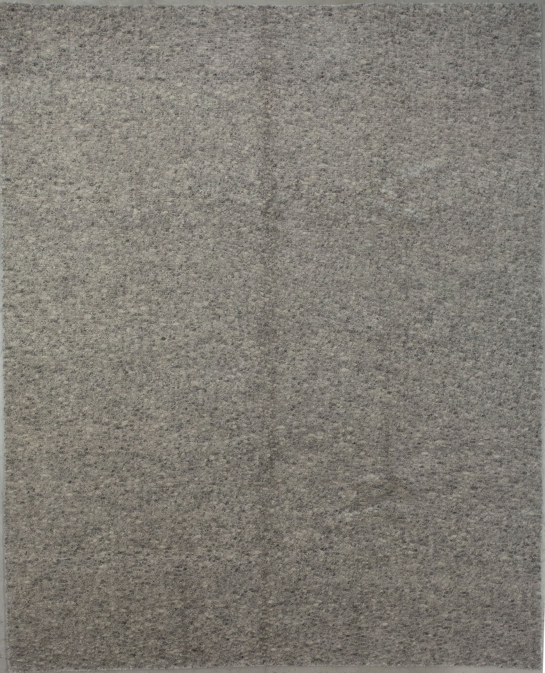 Modern carpet wove with gray and beige color scheme.