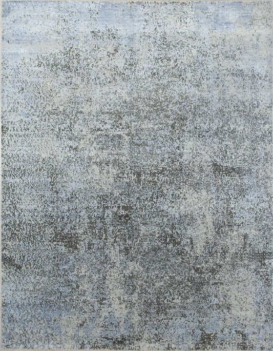 Modern rug comes with splash pattern. The color scheme renders light blue, beige, and black. 