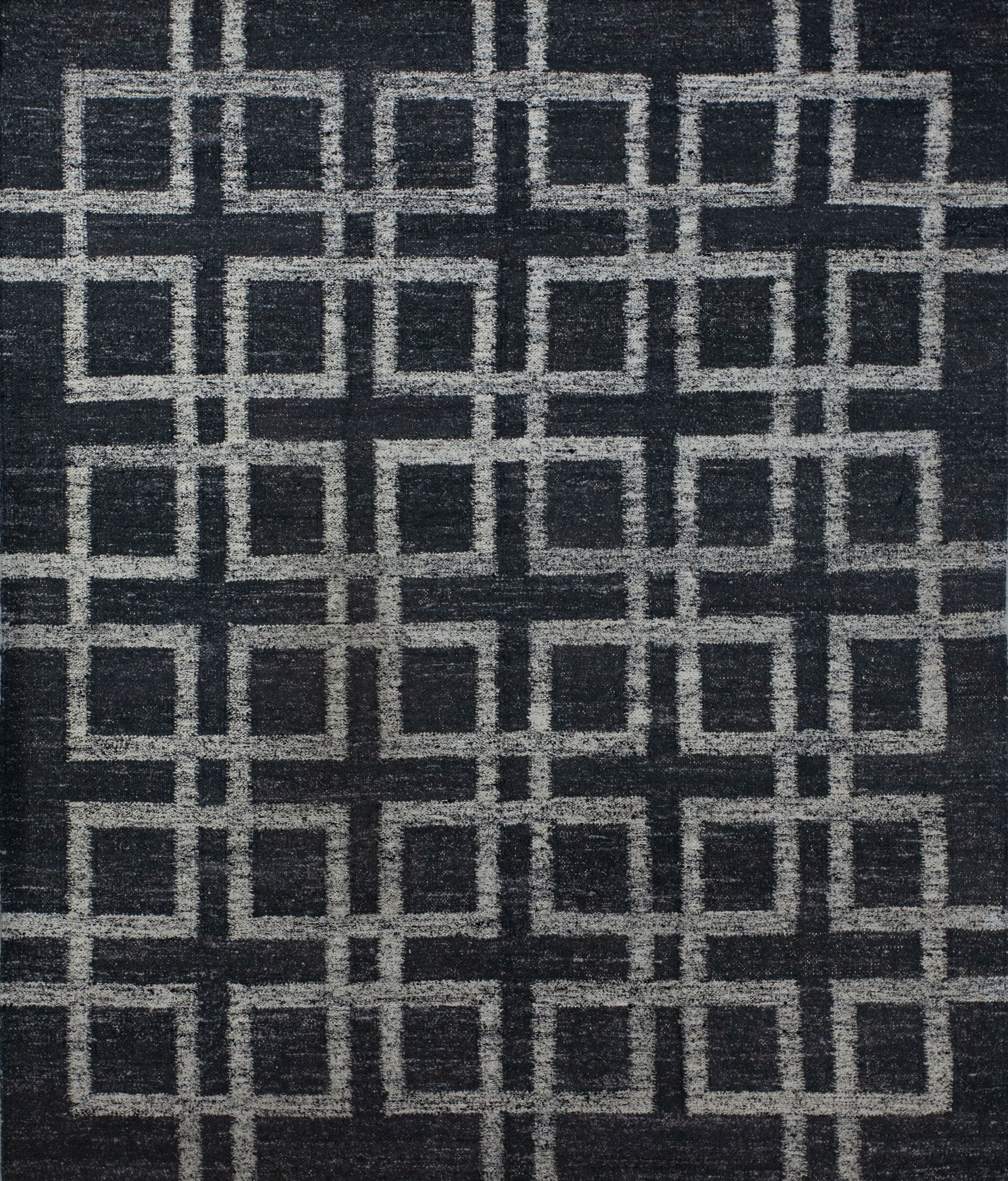 Contemporary carpet comes with black background and an overlapping white outlined square pattern which renders symmetrically. This rug is great for the business lobby because it brings the vibes of order, target, and goals. 