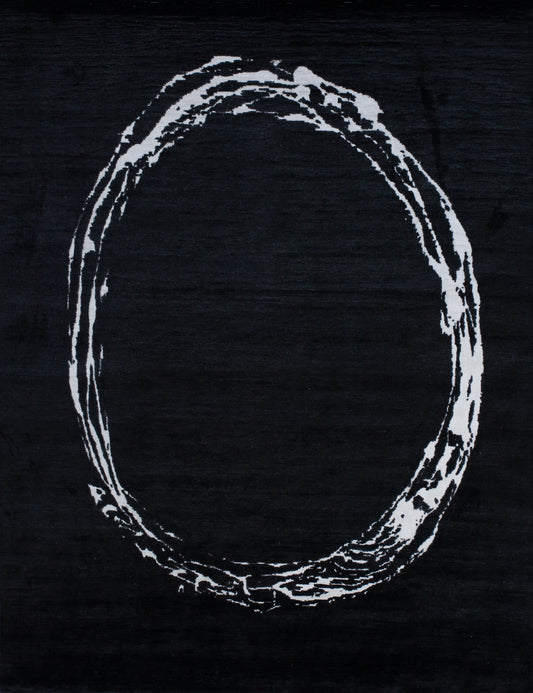 This stylish black rug with a big white ring in the center.