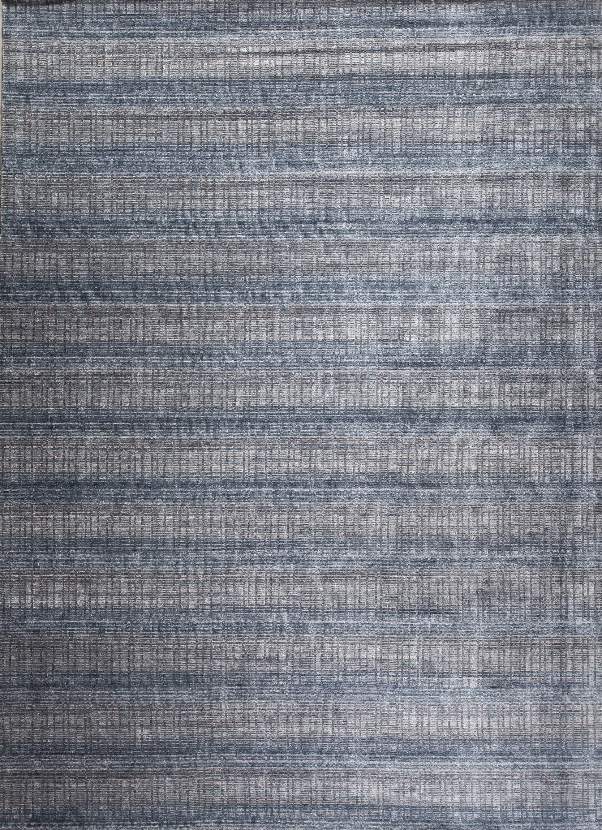 This modern youthful carpet comes with a very cool jeans pattern, and it's a nice option for a teenager room. The horizontal knitted pattern is in navy blue while vertical lines are in light gray tones. 