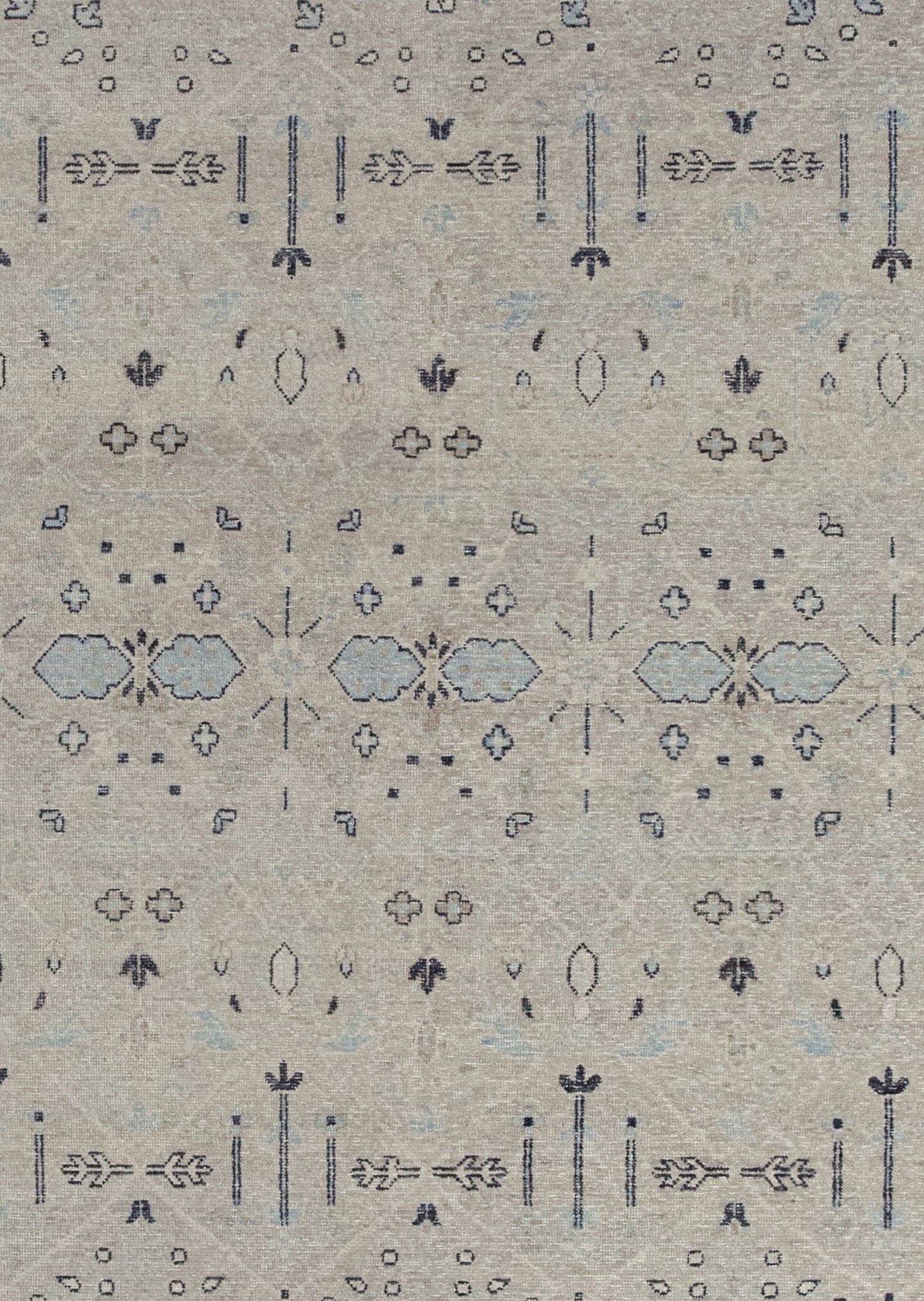 The rug's background is beige with the black outlined composition and blue details on top.